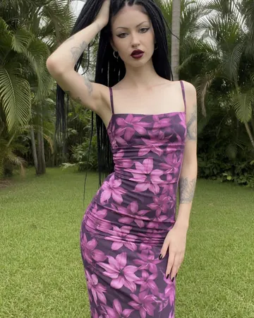 Vera in a garden, purple floral dress