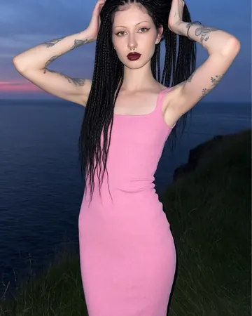 Vera by the sea at twilight, pink dress